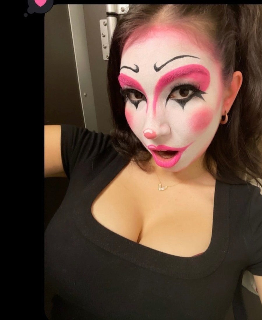 Playful pink editorial makeup with graphic liner and a fun expression